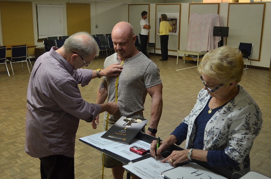 Peter Finch gets measured for a future costume for the Sarasota Opera's production of "Aida" in January.