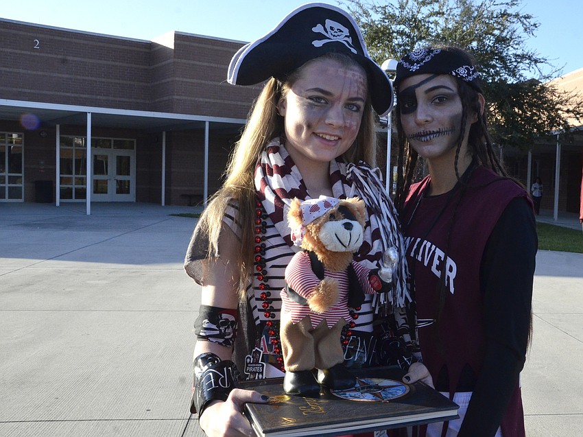 Carrie Dutting and Laura Rodriguez dressed up as pirates. Dutting even has a book of piratology, which she incorporated into her costume.