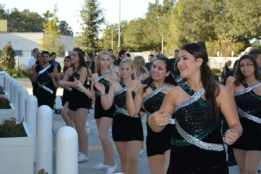 Members of Lakewood Ranch High School's marching band entertain the crowd at Wawa's opening on Friday.