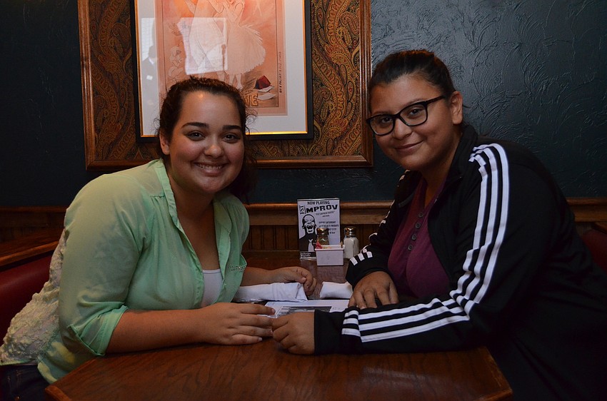 Members of the Booker High School Key Club Arlenis Ramirez and Melisa Escobar.