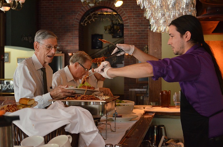 Larry Schaper is served by Florida Studio Theatre staff member Josh Rodoski.