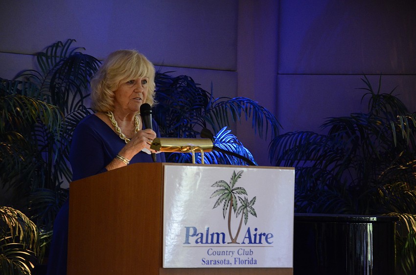 Jan Morrow, owner of Daily Cotton in Sarasota, talks about each outfit as the models display the items.