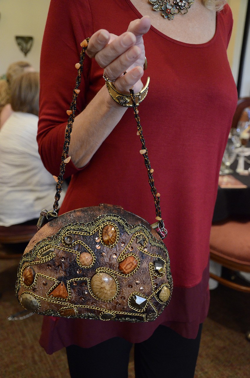 Melodie Dickson displays a Mary Frances-esque handbag that she paired with her Steven Edwards tunic.