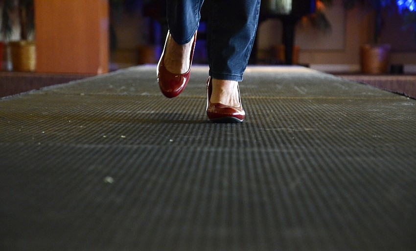 Melodie Dickerson wore red heels with a St. Clair jacket.