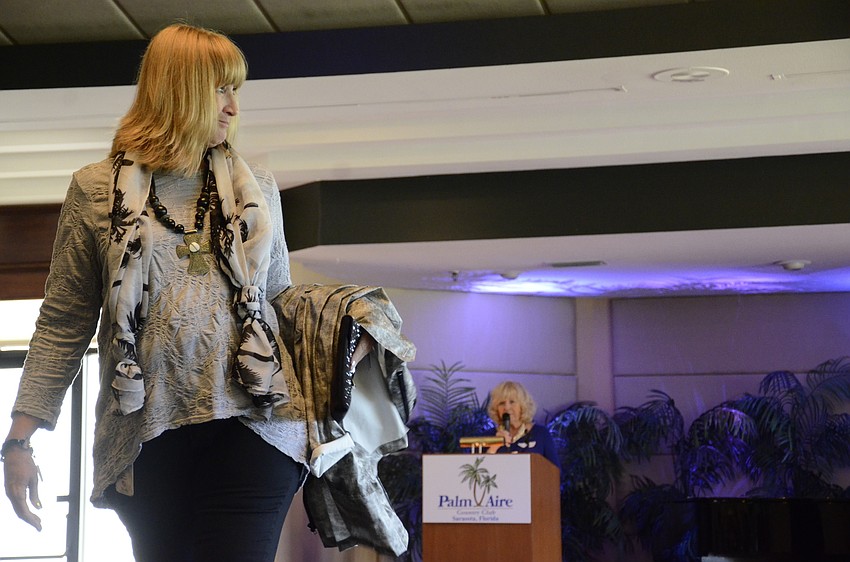 Sherry Bagley removed her Dorman rain jacket to show of the rest of her first outfit.