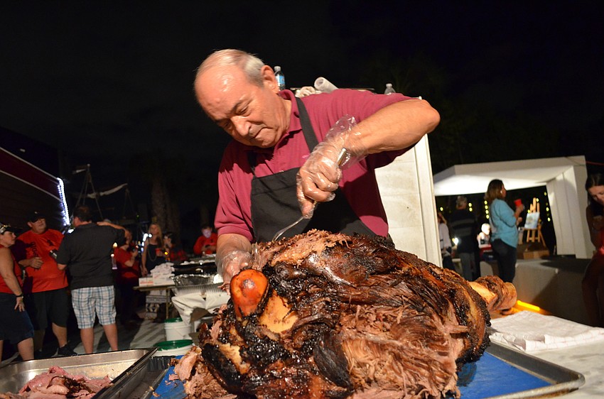 Alex Kouvatsos from Village Cafe helps carve up a meal fit for pirates.