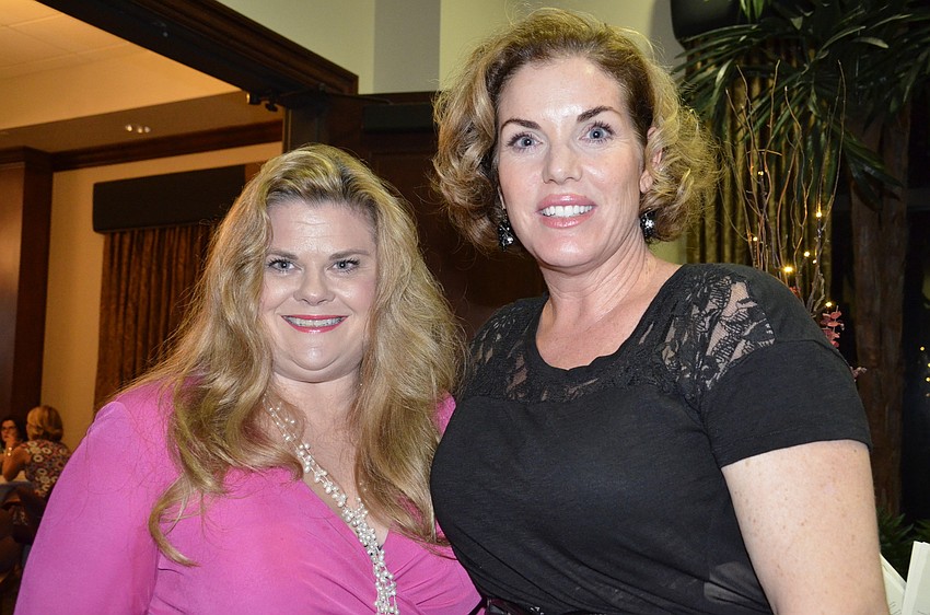 Jeules Gibson of Sarasota and board member Kim Miele of Bradenton