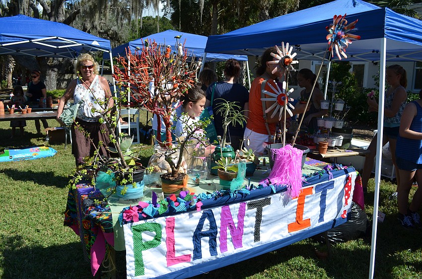 Guests were treated to activities like decorating potted plants. The featured plant was the lyre leaf sage.