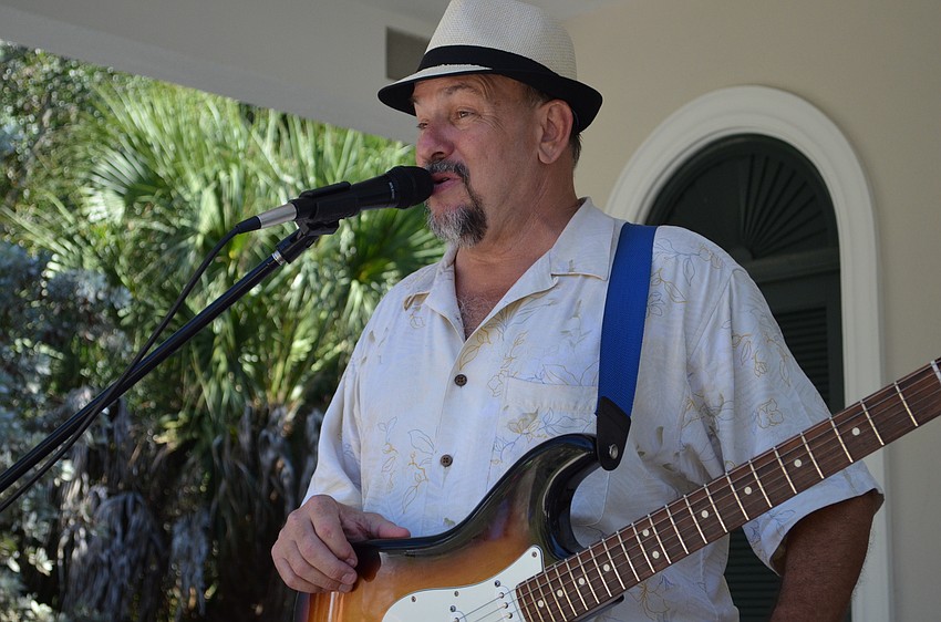 Tommy Rox on the guitar performs for families at Bay Preserve.