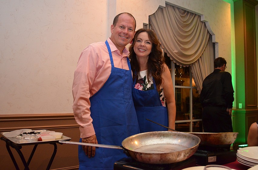 Corey and Bridgett Byzewski prepare to cook up the first course.
