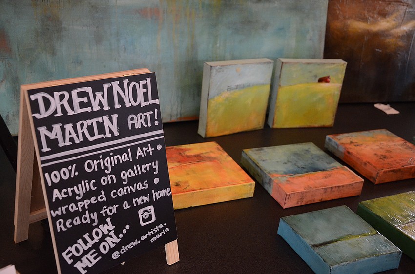 Drew Martin with Drew Noel Martin set up a booth of her artwork.