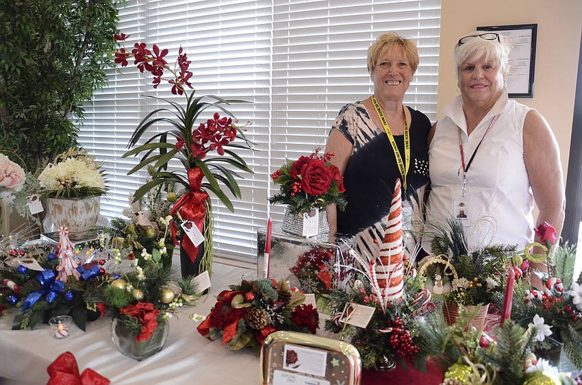 Tina Bianchi with Special Touch Floral Design and Anne Lofquist with Wreaths by Anne shared tables for their products.