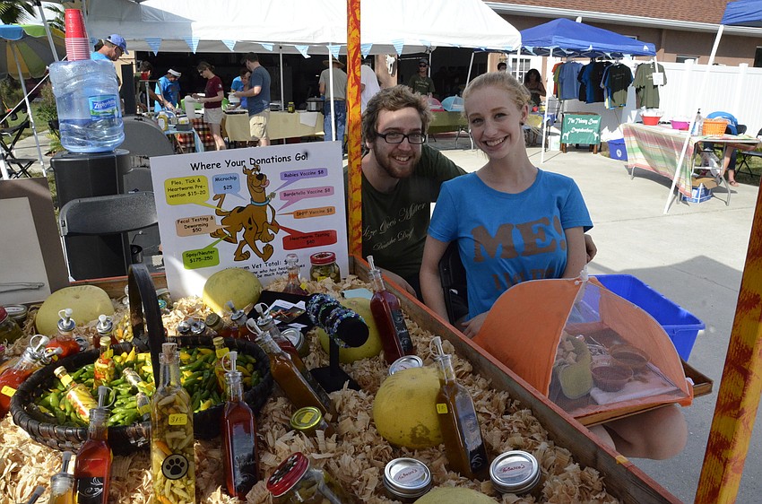 Bradenton residents Josh Bush and Madison Urban supervise the hot sauce bar.
