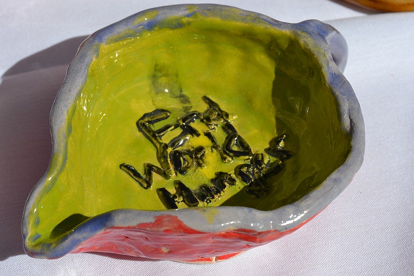 Handmade clay bowls were crafted by students at Sarasota County Schools and local artists.