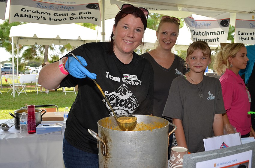 Fiona Farrell scoops up a buffalo chicken soup from a combined effort from Gecko's and Ashley's Food Delivery.
