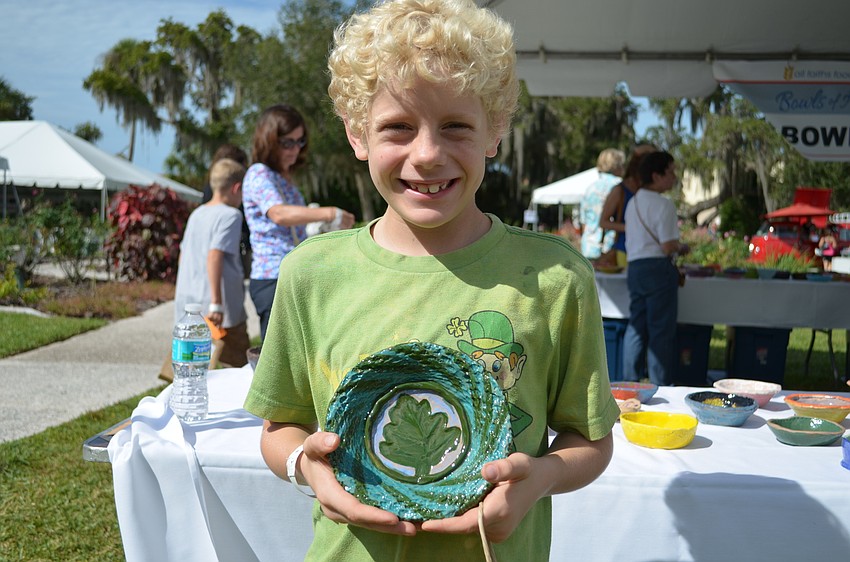 Gaelen Simonson hold a bowl he picked out.