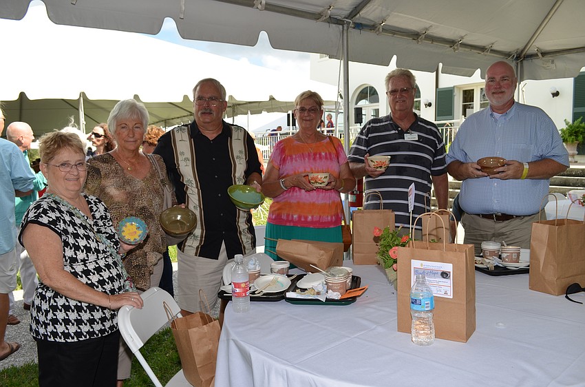 Karen Ewing, Marsha Snyder, George Isaacson, Sandy and Paul McHenry with Brad Lutz.