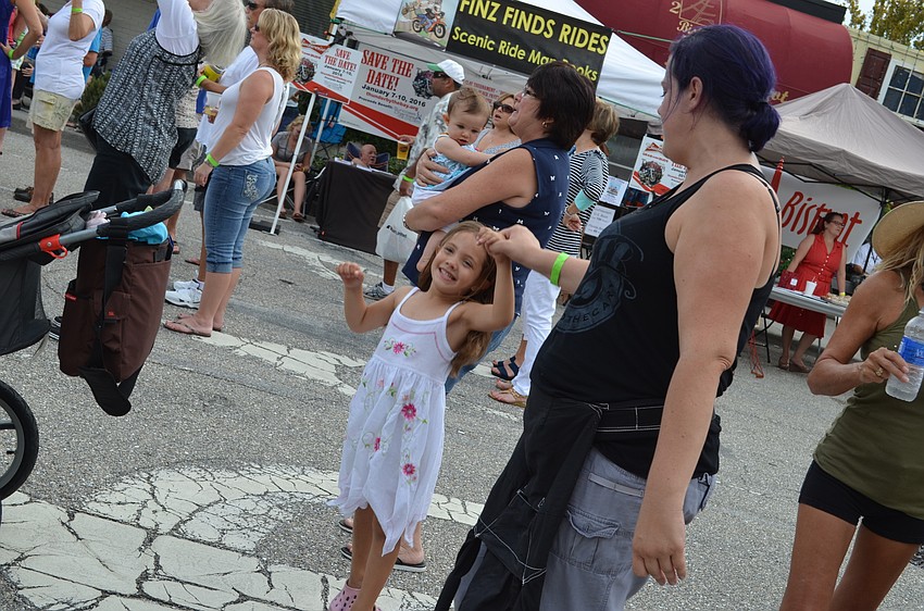 Emma Restle spins to the music with Lauren Karabatsos.