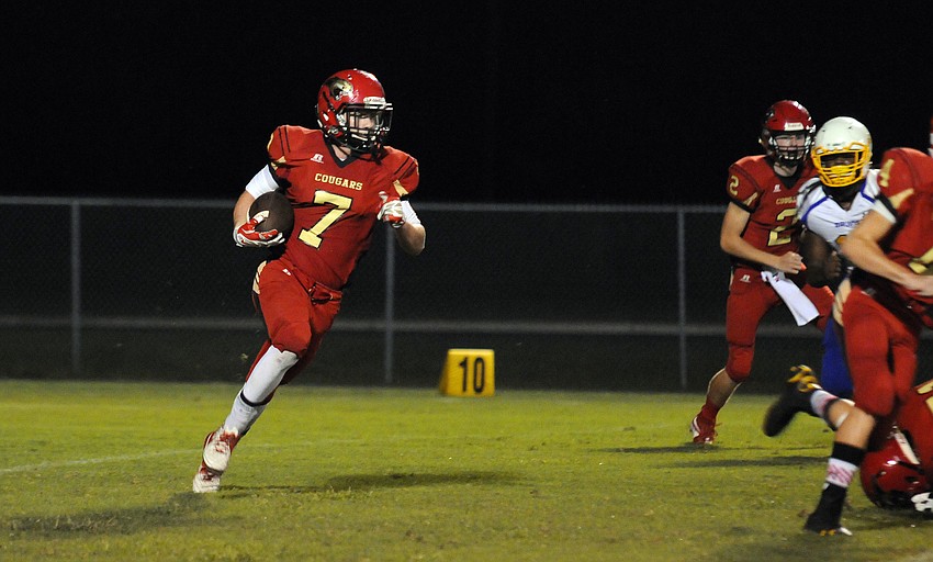 Cardinal Mooney senior Alex Sobczak returns a punt in the first quarter.
