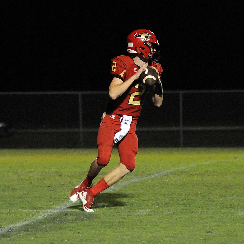 Cardinal Mooney quarterback Tristan Hillerich drops back for a pass in the first quarter.