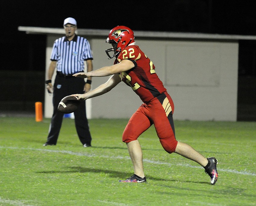 Jake LaFemina punts the ball in the first half.