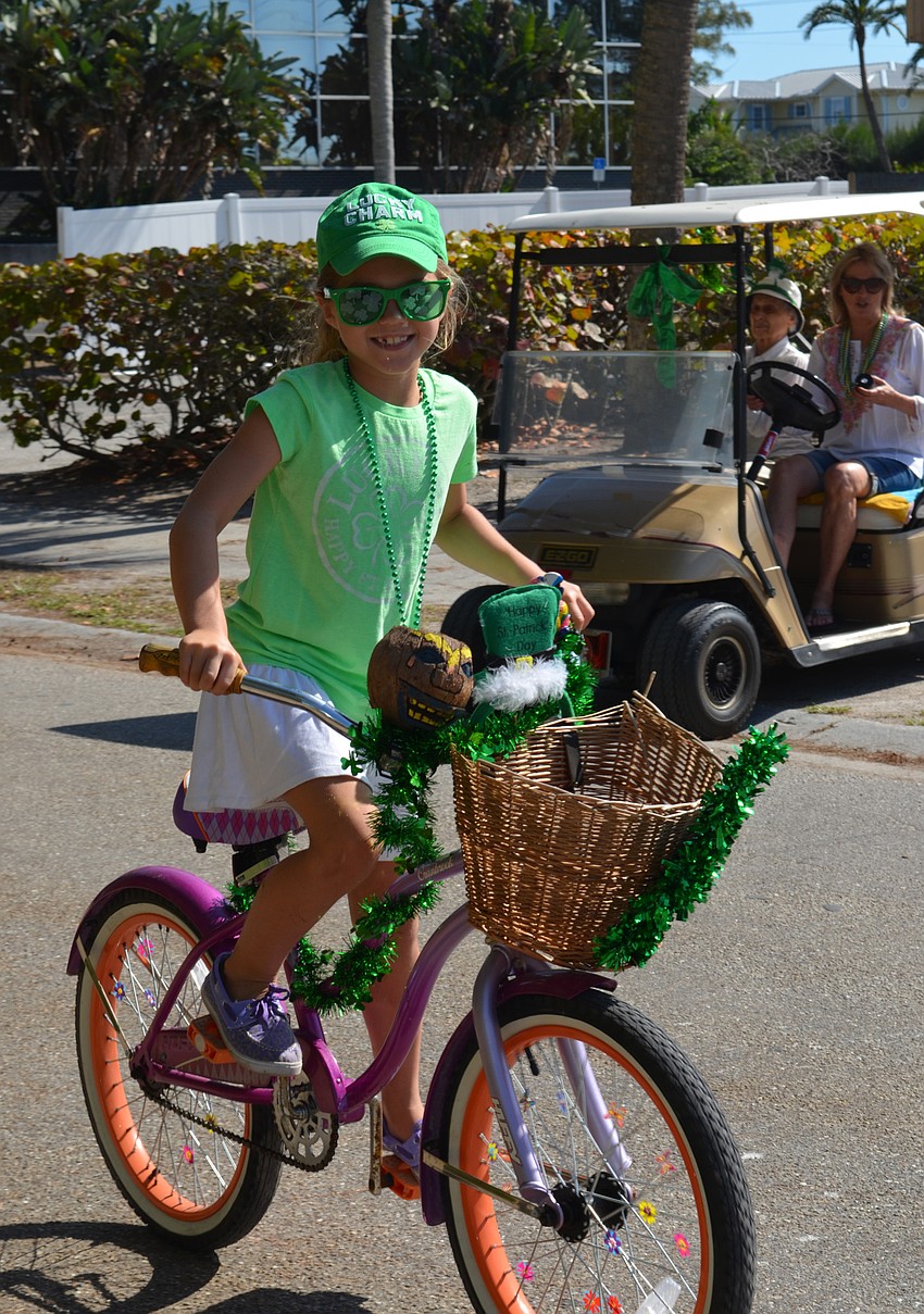 Cassie Calver rides her bicycle in the parade.