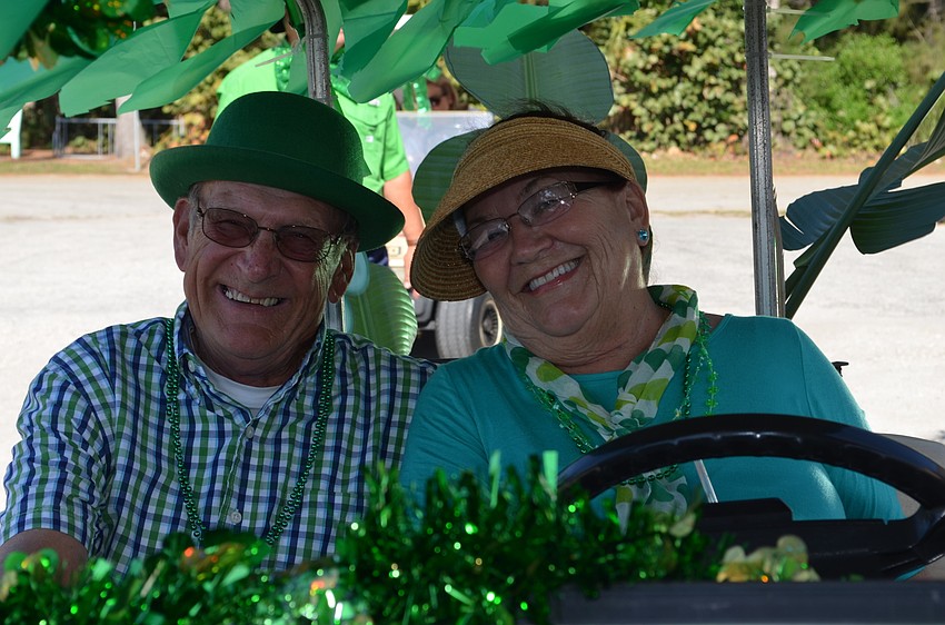 Dave and Shirley Myers drove in a decorated golf cart for the Longbeach Village St. Patrick's Day Parade.