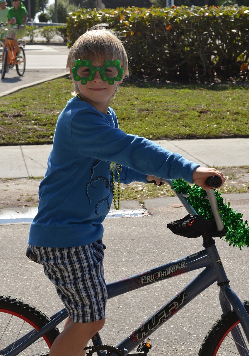 Gabrielle Hoover rides along in the parade.