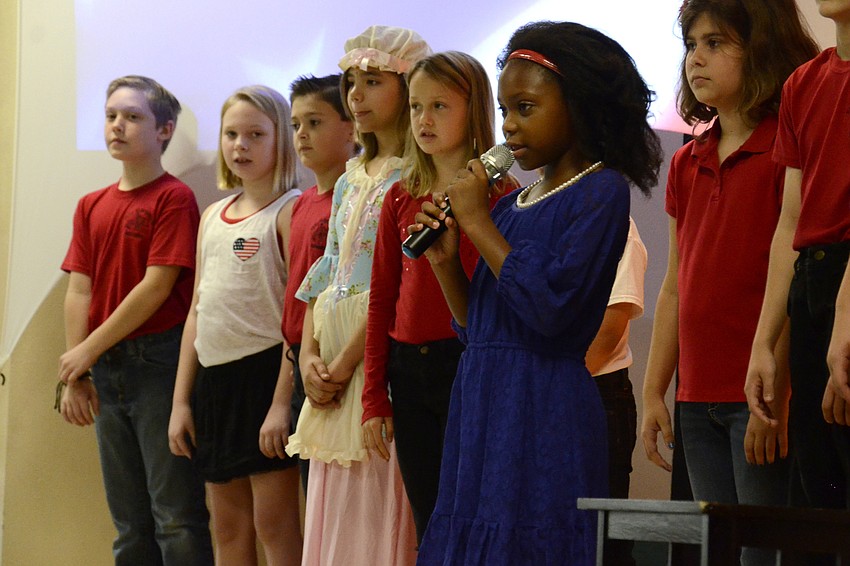 Alexandria Williams talks about the meaning of patriotism during the assembly.