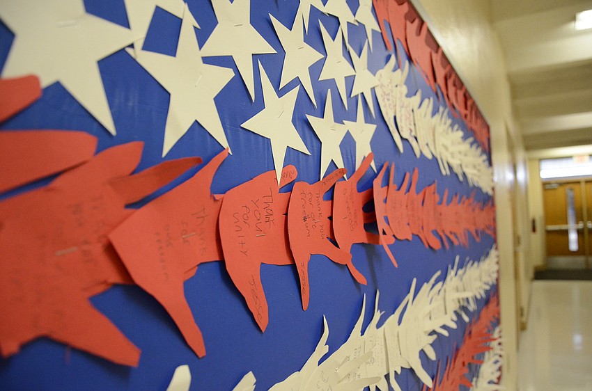 Students traced their hands and made a flag with the cut outs, with messages with statements like 