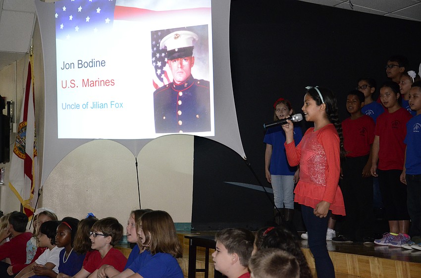 Victoria Oliviera sang a solo during the slide show of fellow classmates and faculty's family members in the military.