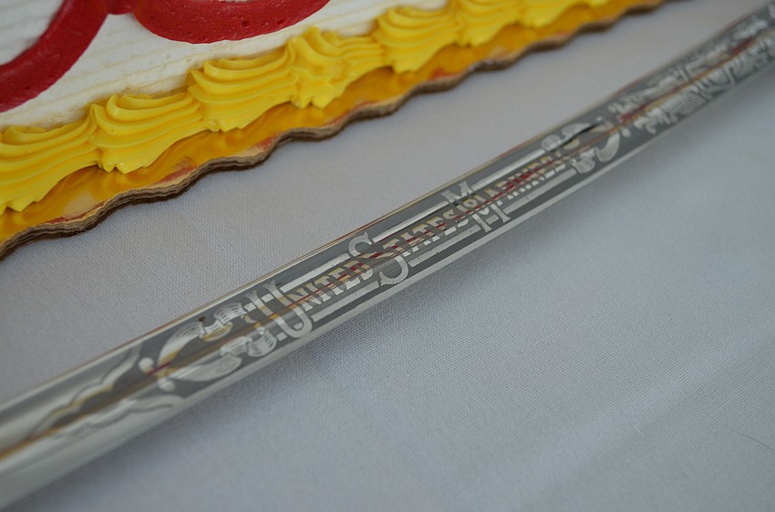 The engraved sword used to cut the cake for the event.