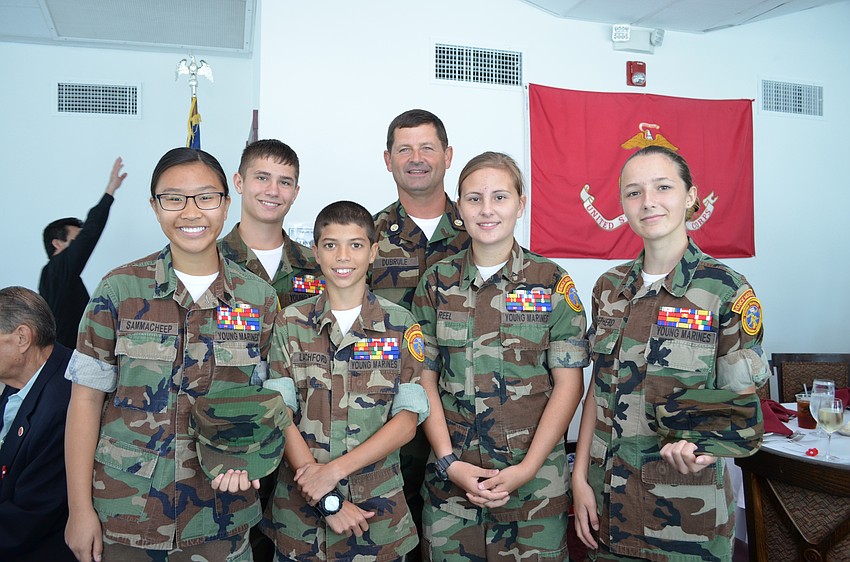 Maj. Mike Dubrule with students of the Venice Middle School Young Marines Thanasorn Sammacheep, Talon Antolak, LandenLatchford, Sierra Reel and Sophie Shepherd.