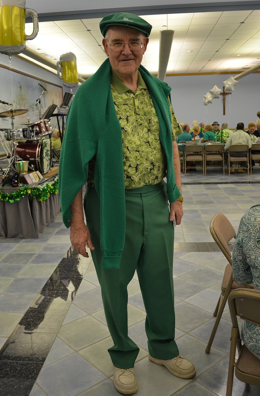 Father Gerry Finegan wore green from head to toe.