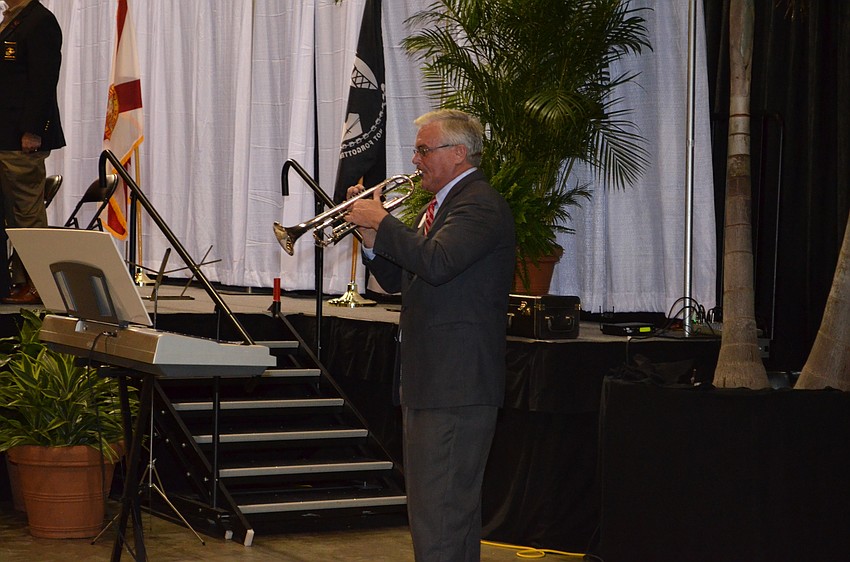 Danny Bilyeu performs a medley of the songs from all five branches of the armed forces.