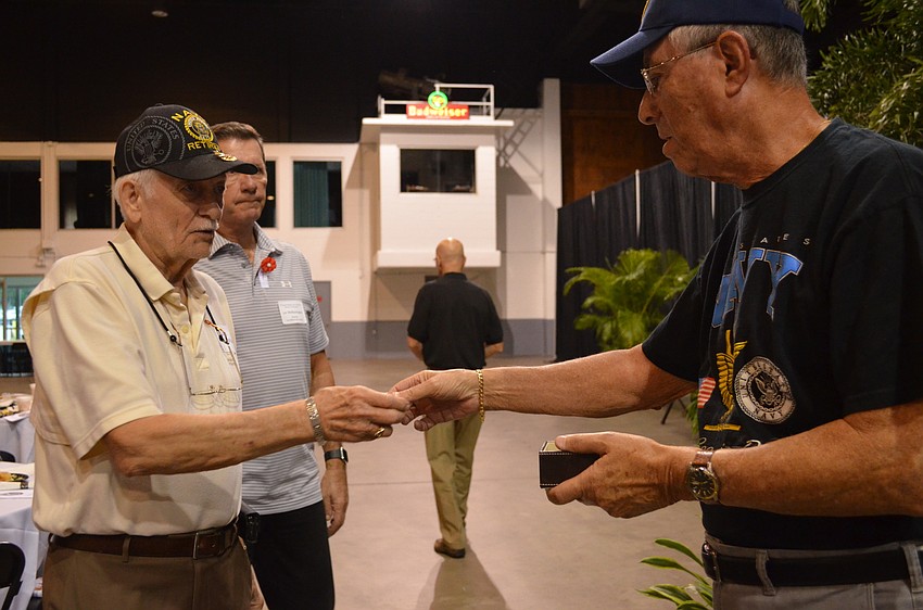 Mills Carlson receives a pin for serving in the Vietnam War.