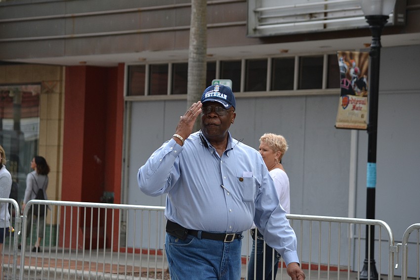 Sarasota Mayor Willie Shaw salutes veterans during the parade.