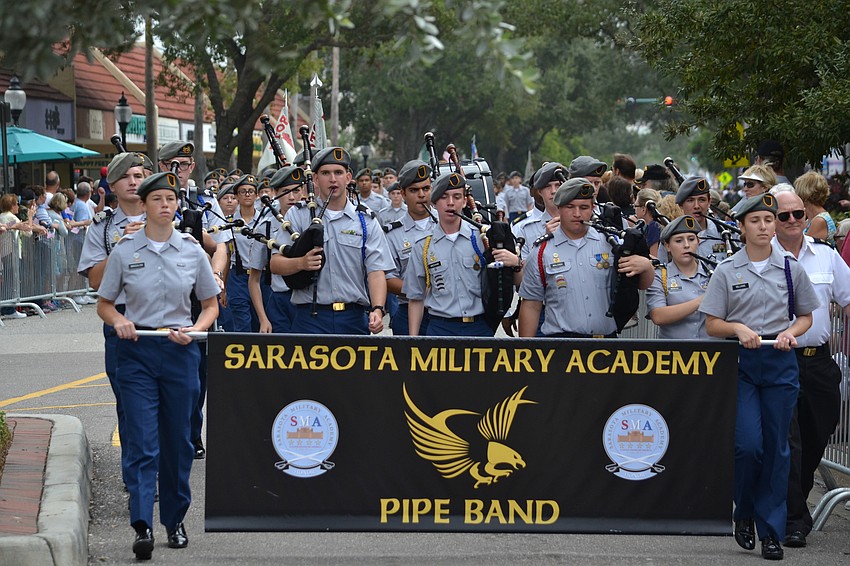 Cadets from the Sarasota Military Academy Pipe Band play along the parade route.