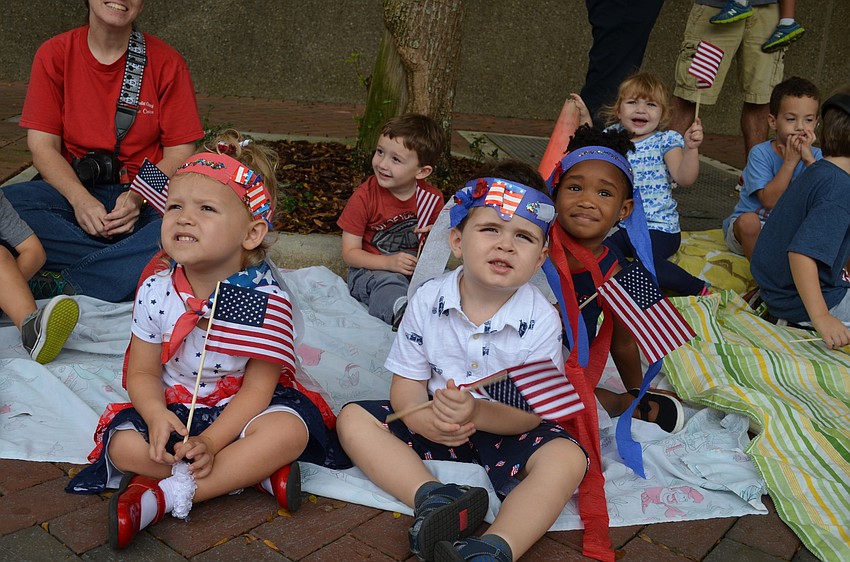 Annabelle Hembree, Cooper Robinson and Allie Bartley wait patiently for the parade to start.