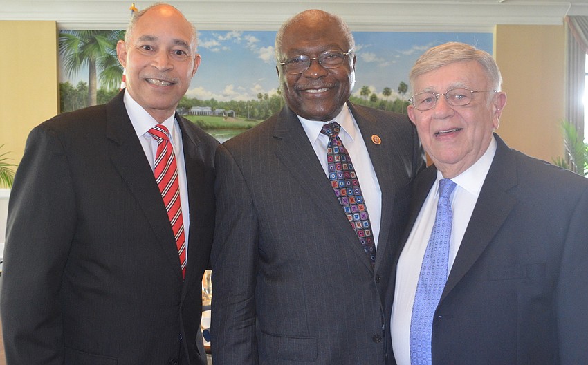 Steven Love, U.S. Rep. James Clyburn and Democratic Club President Murray Blueglass