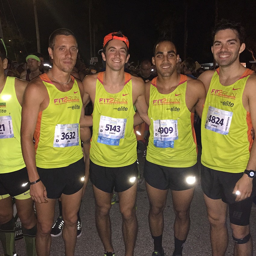 First-place finisher Jon Mott, fifth-place finisher Chris Yanichko, Gilbert Vazquez and fifth-place finisher Chris Trebilcock prepare to start the half marathon.