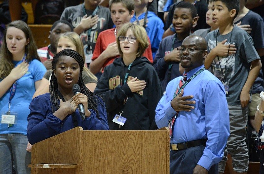 Abba Sankah leads the student body in the Pledge of Allegiance.