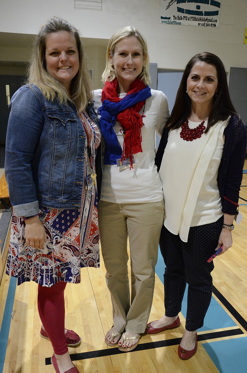 Amy Bane, Amie Poole and Kelly Galvin, sixth-grade teachers, dressed up in patriotic attire.