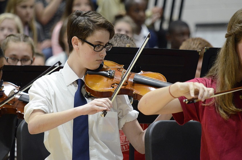 Anna Zimmerman plays the violin during the orchestra performance.