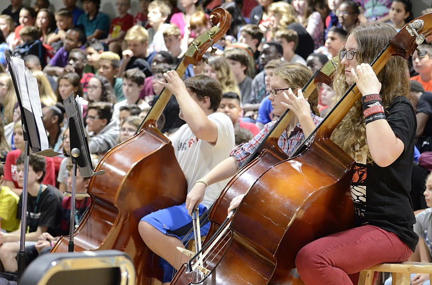 Trebor Rivard, Jordyn Collis and Rain Miller play base.