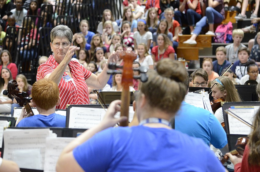 Valerie Terry directs the orchestra.