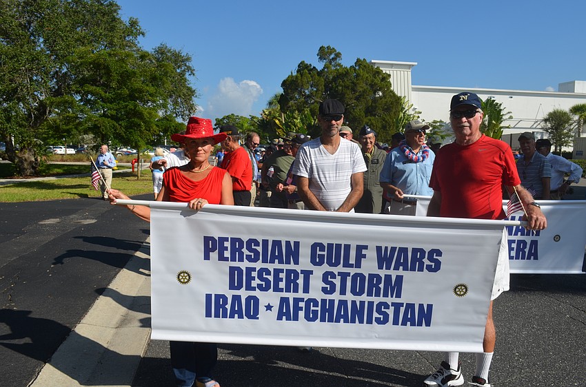 Persian Gulf War veteran Brad Hoover, center, with Sunny and Rich McGrath