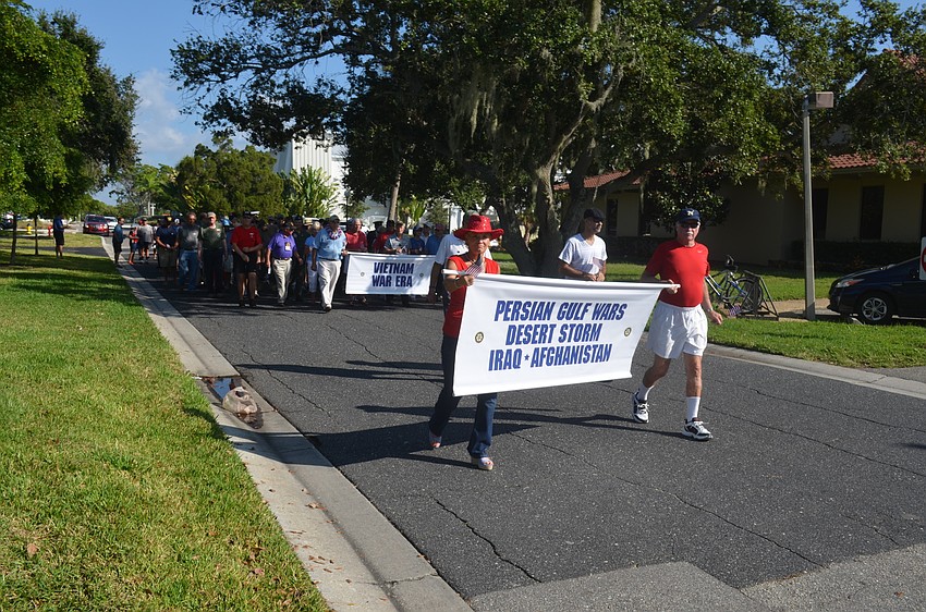 Veterans march in the parade.