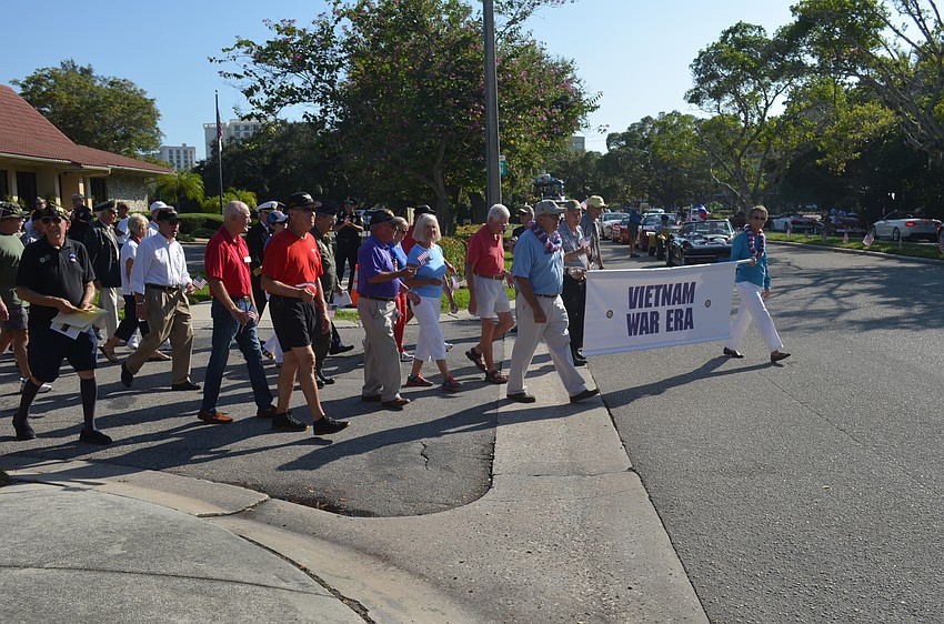 Vietnam War era veterans march in the parade.