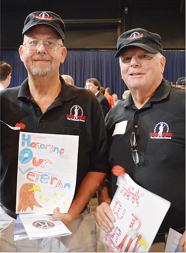 The Sarasota Kiwanis Club thanked veterans with a special breakfast on Wednesday morning at Robarts Arena, including a presentation by local leaders and cards made by McIntosh Middle  School students, shown here by Ernest Lohmann and Hal Noonan.